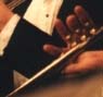 Tom's hand playing his trumpet